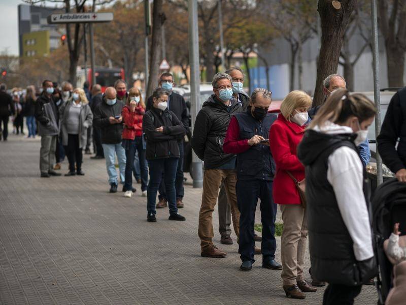 People line up to receive a dose of the AstraZeneca coronavirus vaccine in Barcelona.