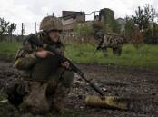 Ukrainian forces stopped a Russian advance near the eastern city of Izium, the governor says.