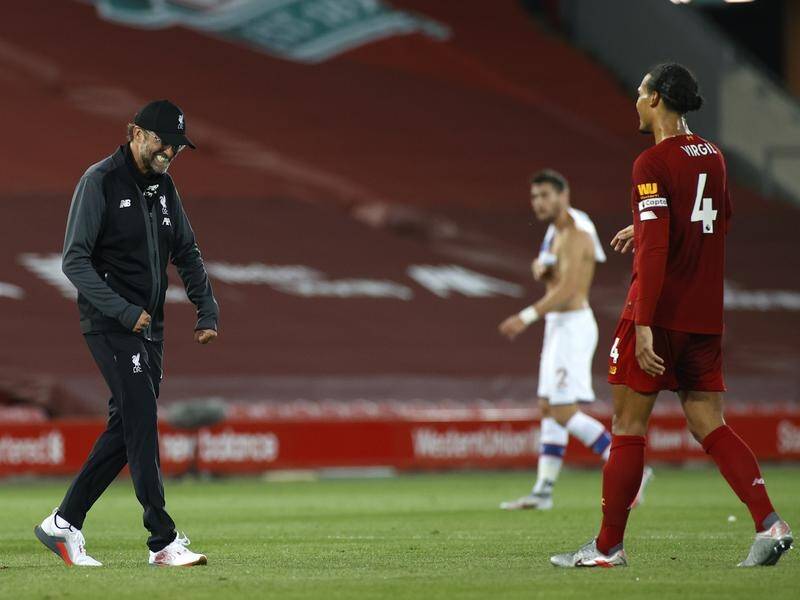 Liverpool boss Juergen Klopp (l) paid tribute to the club's legends after winning the league title.