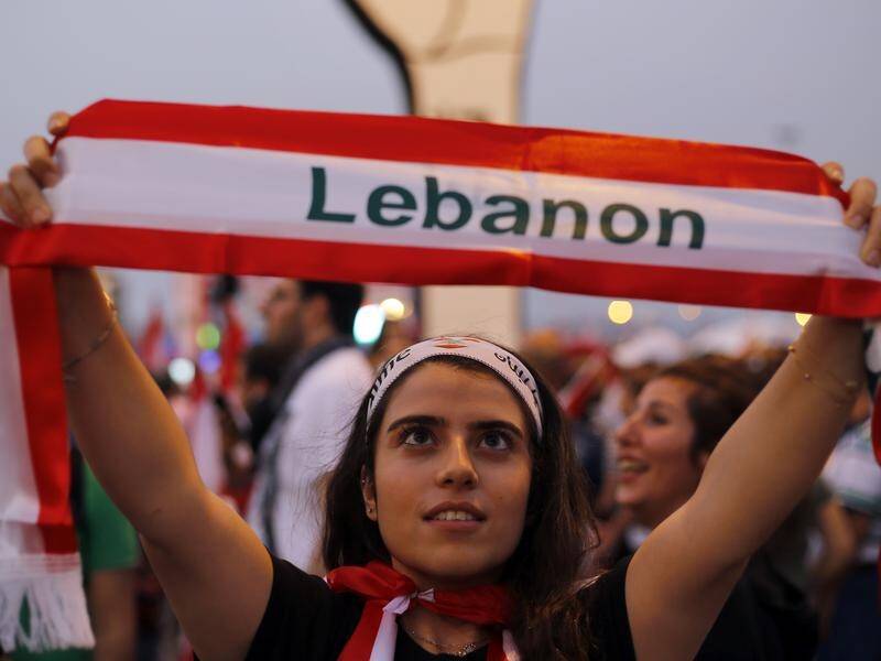 Lebanese protesters have flooded Beirut streets for an 11th day, demanding the government resign.