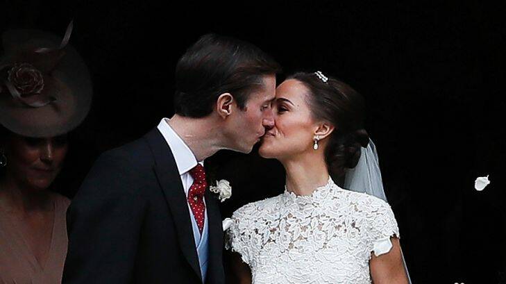 Pippa Middleton and James Matthews kiss after their wedding at St Mark's Church in Englefield, England Saturday, May 20, 2017. Middleton, the sister of Kate, Duchess of Cambridge married hedge fund manager James Matthews in a ceremony Saturday where her niece and nephew Prince George and Princess Charlotte was in the wedding party, along with sister Kate and princes Harry and William. (AP Photo/Kirsty Wigglesworth, Pool)