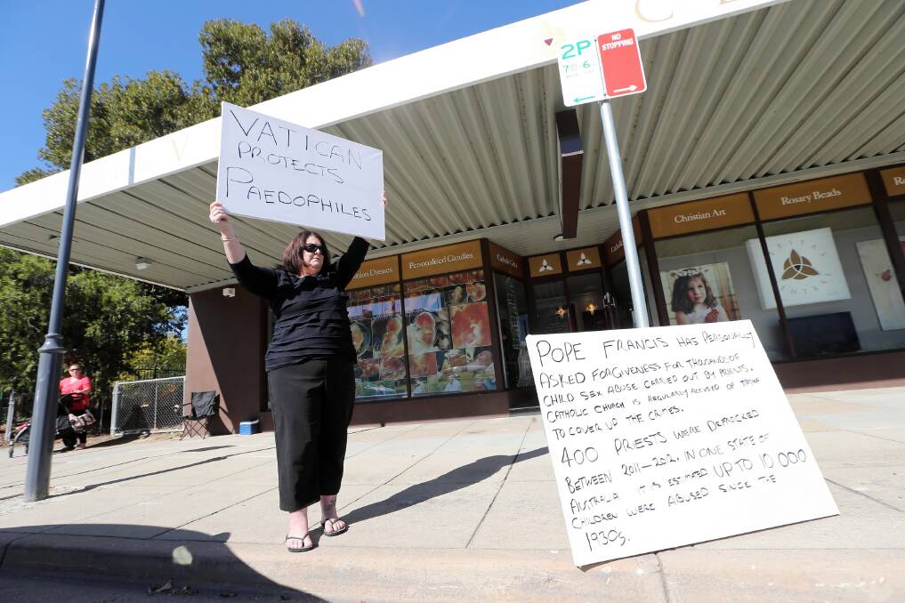 Liz Marmo makes her point outside the Veritas bookshop in Albury. Picture: JOHN RUSSELL