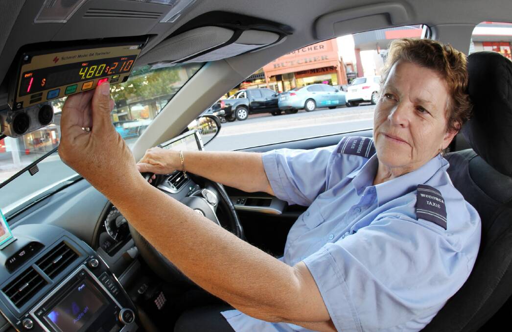 Marie Baker makes sure she is ready for Wodonga Taxis’ 12.5 per cent fare rise from Monday. Picture: KYLIE ESLER