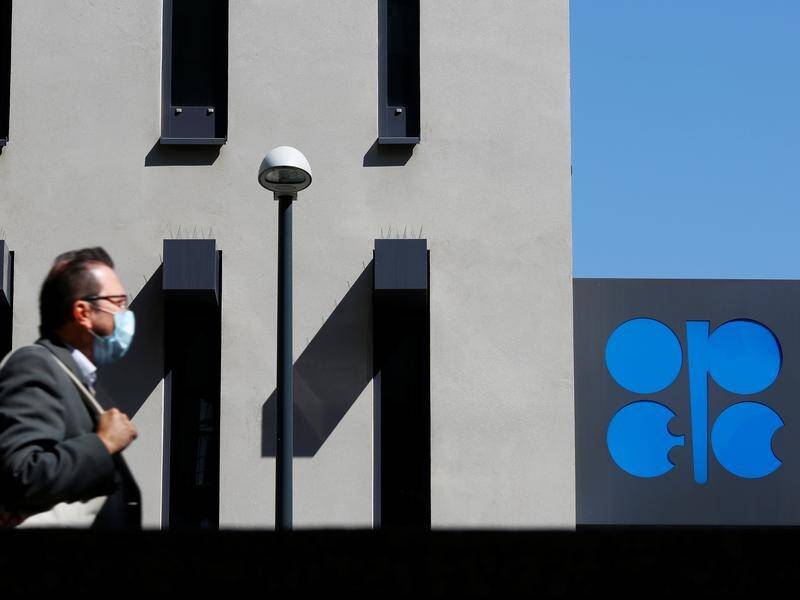 OPEC members and other oil producing countries have agreed to the largest output cut ever.
