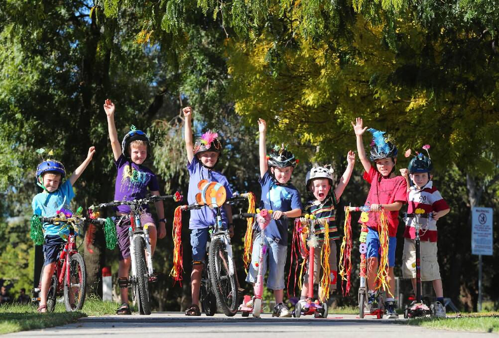 If it was about a “hands up for a great day out”, this was a ringing endorsement of the Wodonga Council’s bedazzle your bike day from Justin, Joshua and Matthew Gill, Harry Poole, Robert Kelson, Sebastian Poole and James Kelson. Picture: JOHN RUSSELL