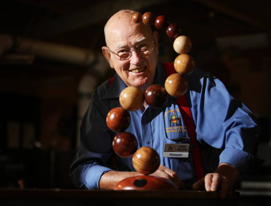 Woodcrafters president Doug Malsem with his piece “Have a ball”.