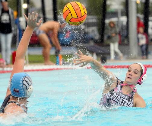 Pirates’ Ashleigh Cooper gets the ball away over Brooke Dickie. Picture: KYLIE ESLER