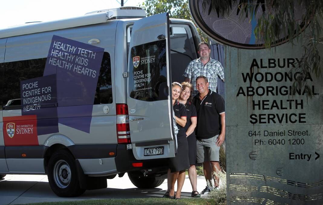 Jocelyn Wright, Nicole Rootsey and Graham White, from the Poche Centre for Indigenous Health, and Rowan Simmons, from the Centre of Oral Health Strategy NSW, with the new multipurpose van. Picture: MATTHEW SMITHWICK