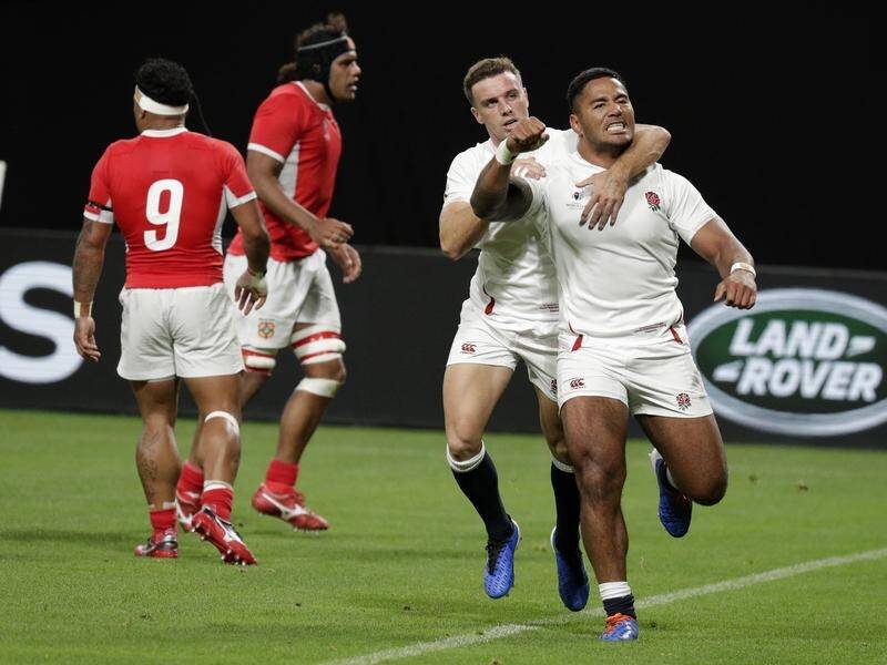 Manu Tuilagi (R) has scored two tries in England's 35-3 Rugby World Cup-opening win over Tonga.