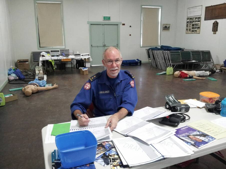 Des Finn at work in the Albury ambulance headquarters, where he undertook several senior roles.