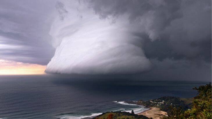 2013 Australian Weather Calendar. - July: A squall associated with a thunderstorm over Era Beach, south of Sydney. Pic Bruce Cooper