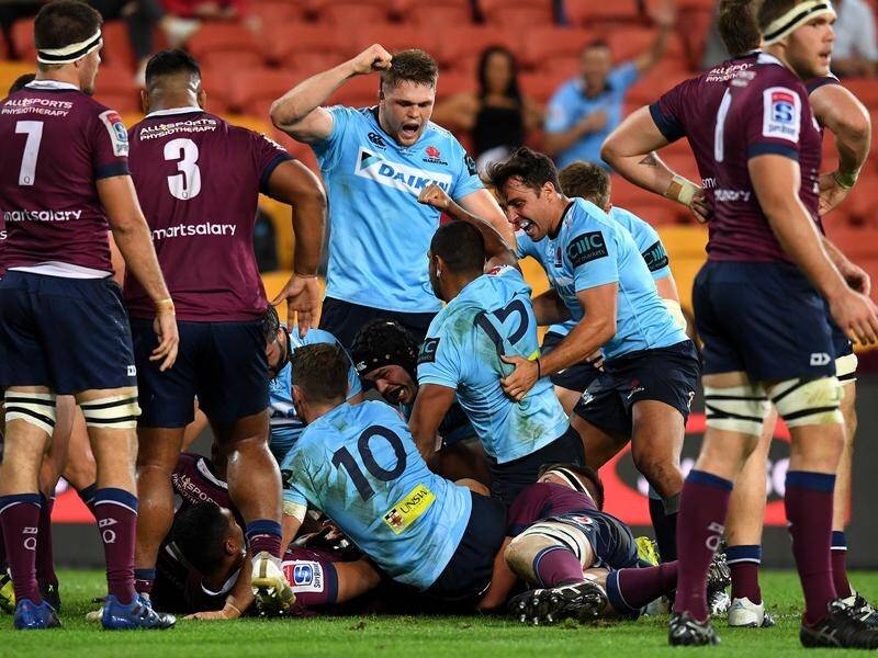 The Waratahs have claimed a tight Super Rugby derby with the Reds, 40-32, in Brisbane.