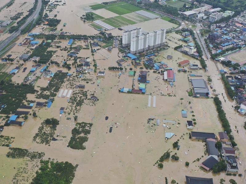At least 26 people have died in floods and landslides in South Korea after 46 days of rain.