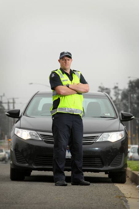 Constable Scott Woodstock, of Wangaratta police, is urging drivers to turn on their headlights in fog or risk a collision or fine. Picture: DAVID THORPE