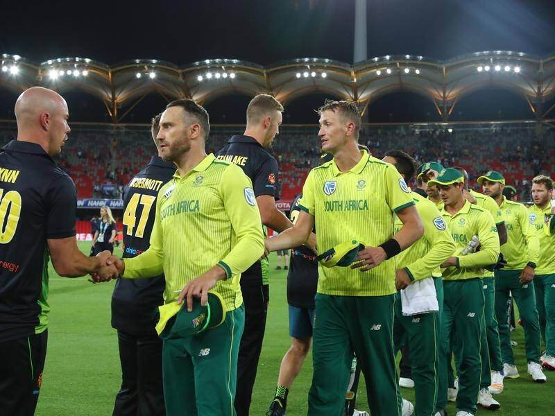 SA skipper Faf du Plessis shakes hands with Australia's Chris Lynn after winning their T20 match.