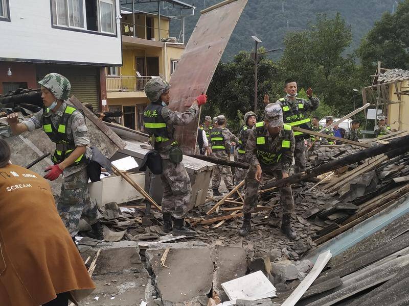 Rescuers in the Chinese province of Sichuan continue to search for earthquake survivors. (AP PHOTO)
