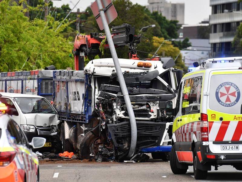 A woman is dead and five pedestrians have been injured after a truck crash in Sydney.