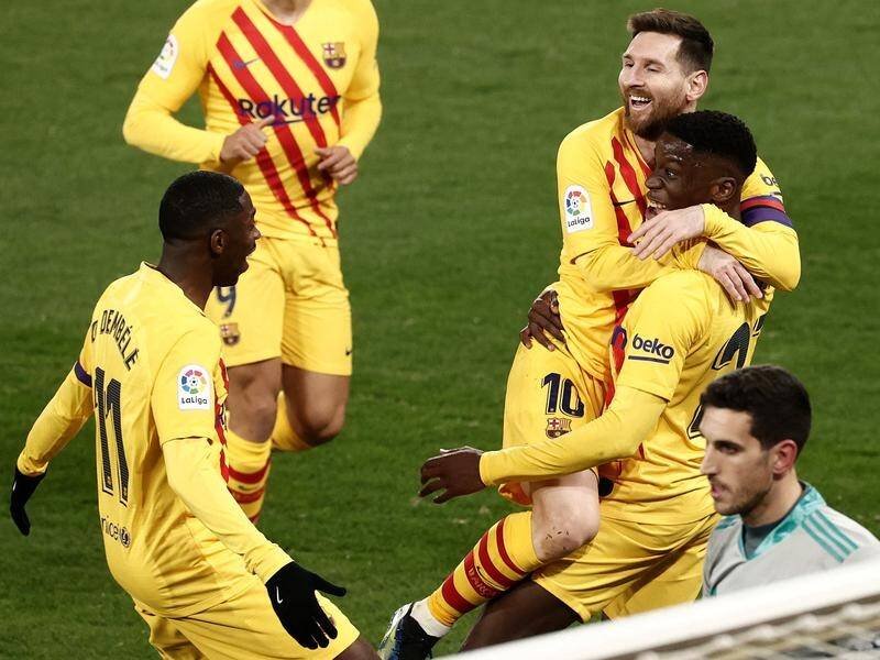 Ilaix Moriba celebrates his maiden La Liga goal with Lionel Messi and other Barcelona teammates.