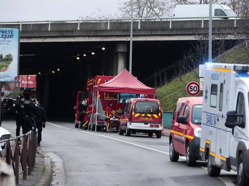 Emergency services at a security perimeter at the park in Villejuif, the scene of Friday's attack.