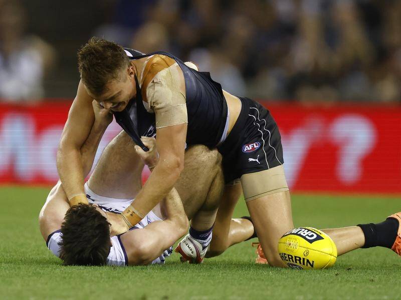 Fremantle players were criticised for allowing Andrew Brayshaw (bottom) to be roughed up by Carlton.
