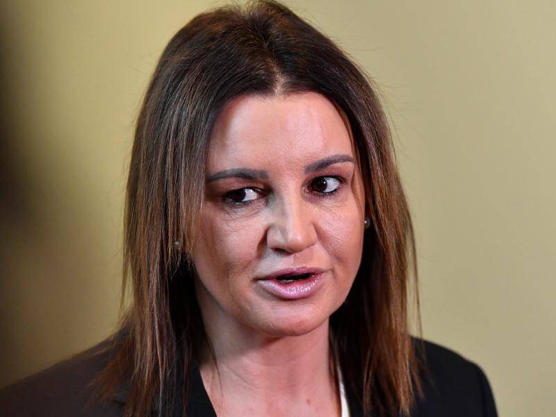 Jacqui Lambie drew attention to Tasmania's now-waived housing debt when backing tax cut legislation.