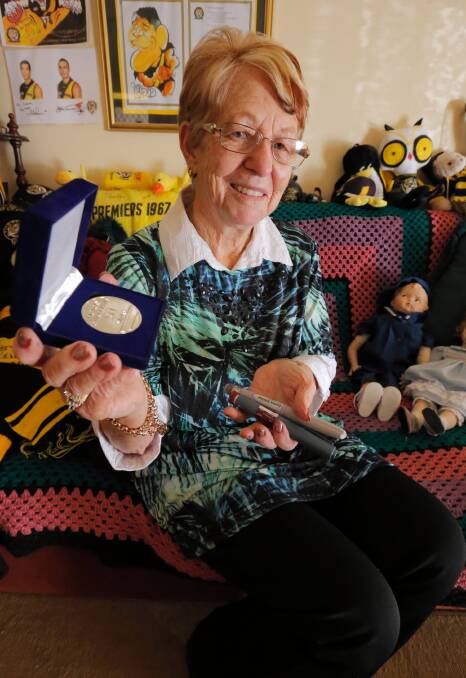 Patricia Riley, pictured with some of her Richmond memorabilia, yesterday received the Kellion Victory Medal for surviving 50 years with Type 1 diabetes. Picture: KYLIE ESLER