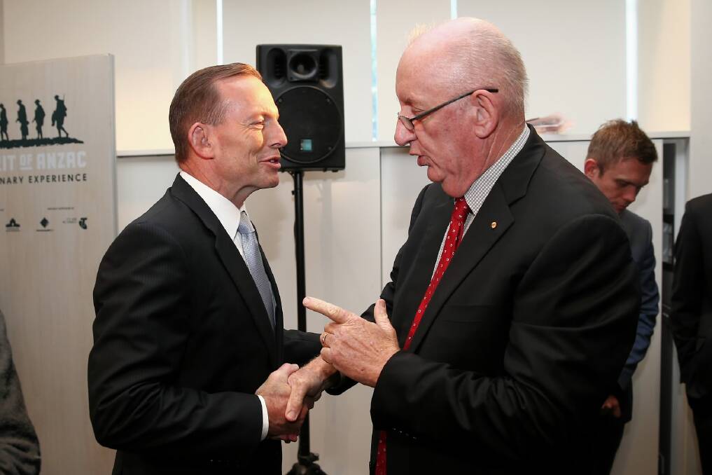 Prime Minister Tony Abbott greets Tim Fischer during the launch of the exhibition. Picture: FAIRFAX