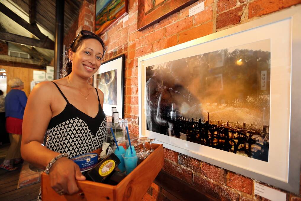 Sarah Tormey picked up some fresh produce and enjoyed the art show at Pfeiffer Wines on Saturday. Picture: PETER MERKESTEYN