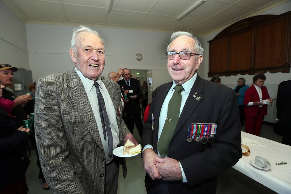 World War II veterans Bob Giltrap and Keith Kimball enjoy morning tea. Pictures: PETER MERKESTEYN