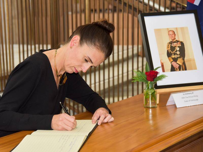 New Zealand's Prime Minister Jacinda Ardern signs a condolence in tribute to Prince Philip.