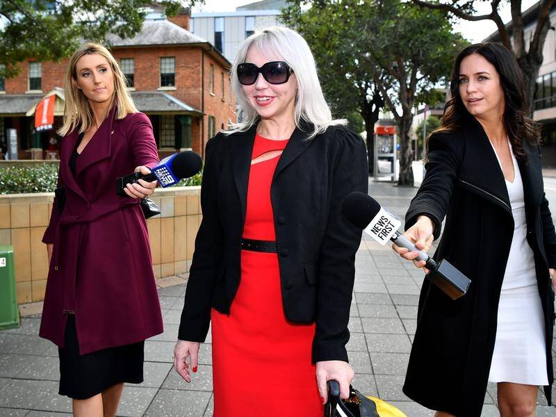 Lawyer Zali Burrows says a Sydney Morning Herald article 'irreparably harmed' her reputation.
