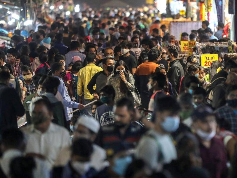 Experts suspect a surge in COVID-19 cases in New Delhi is due to people crowding shopping areas.
