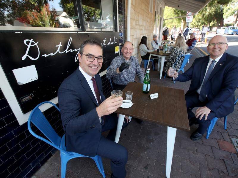 Premier Steven Marshall (L), says South Australians appear delighted with their new freedoms.