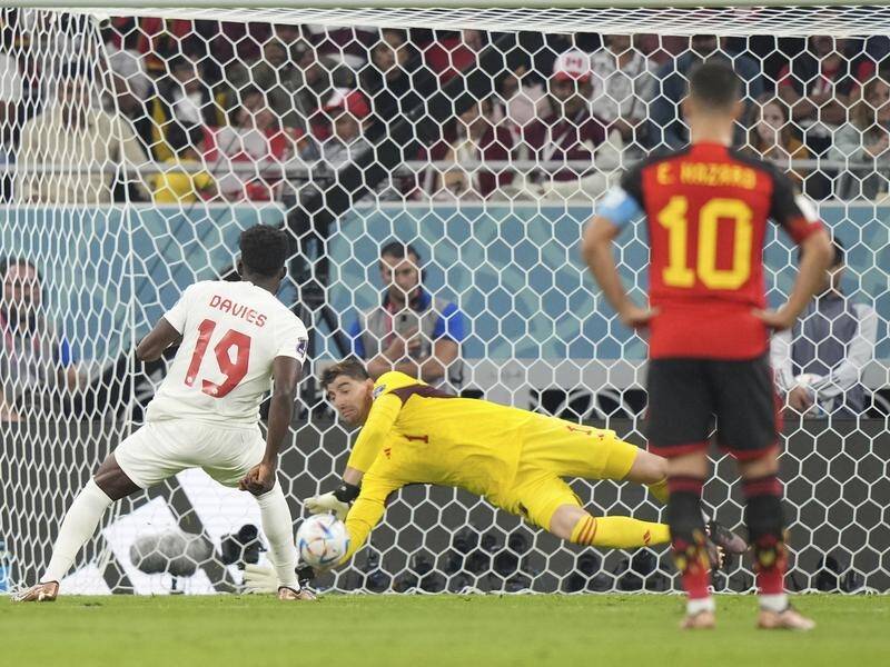 Belgium goalkeeper Thibaut Courtois saves Alphonso Davies' spot-kick for Canada at the World Cup. (AP PHOTO)