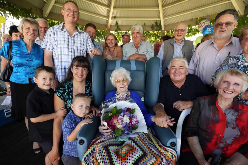 Myrtle Hodgkin, with her son Nevis, holding her hand, and her family and friends, celebrate her 100th birthday. Picture: MATTHEW SMITHWICK