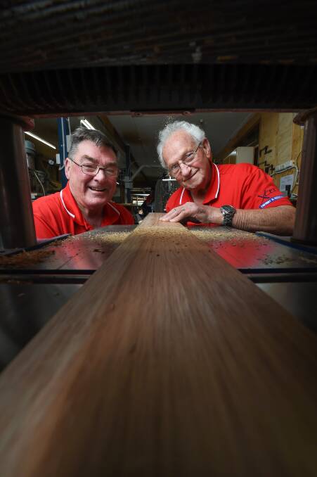 SHED: Clive Walker and Kevin Dinneen show off some of the tools of the trade for woodworking, which have been connected to a new vacuum system.
