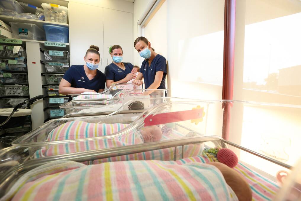 WATCHING OVER: Student midwife Molly Pryse, Acting Nurse Unit Manager Christeena Slee with baby Darcie, and registered nurse Tess Brown. Picture: JAMES WILTSHIRE 