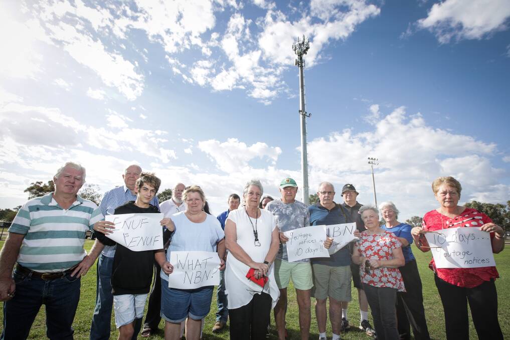 FED UP: Denise Knight, nee Osborne, with Jindera residents protesting the unreliability and uncertainty aorund their NBN connections. Picture: JAMES WILTSHIRE