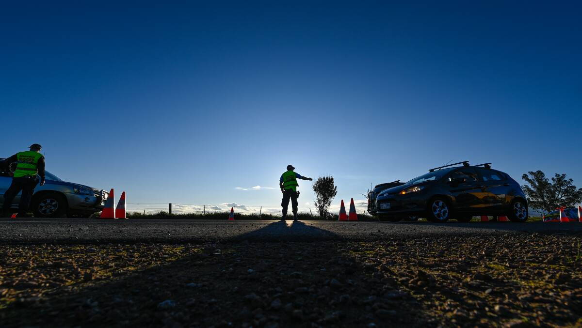  NSW Police man the border check point on the Riverina Highway in July. Picture: MARK JESSER 