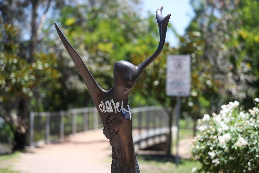 UNWELCOME SIGHT: The graffiti across the bronze statue in the Celebration Garden cannot be missed. Picture: MARK JESSER