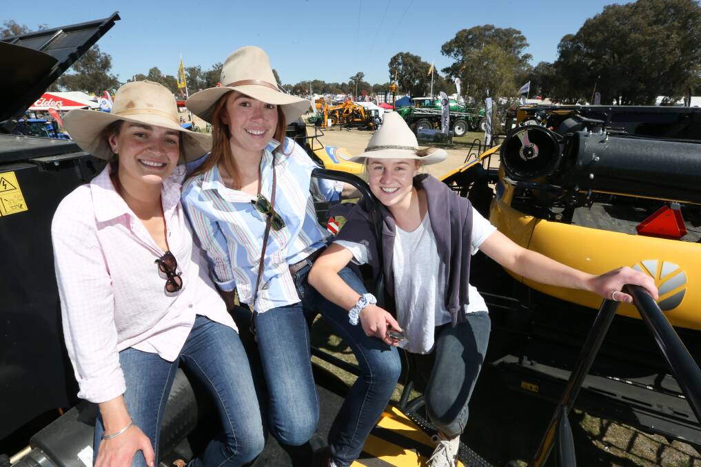 ALL ABOARD: Wagga residents Katie Mitton, Sophie Mitton and Millie Milne enjoying the Henty Machinery Field Days. Picture: Kylie Esler