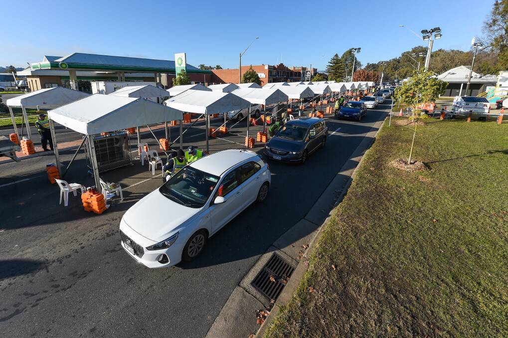 DIVIDED: NSW Police and Australia Defence Force personnel work the Wodonga Place, Albury, checkpoint on July 21. The checkpoints were in force from July 8 12.01am. Picture: JAMES WILTSHIRE 