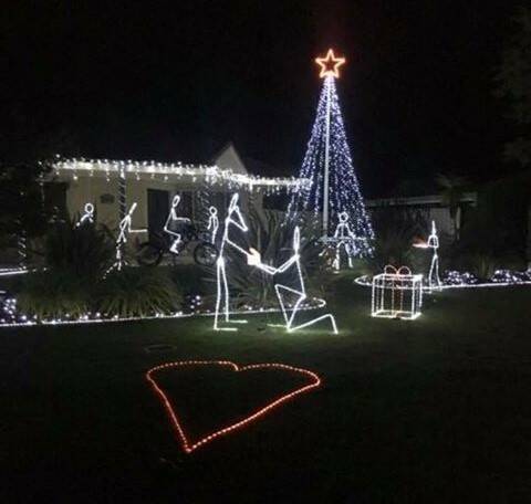 SHE SAID YES: Rodney Deighton's impressive Christmas light display depicts every member of his and Miss King's blended family.