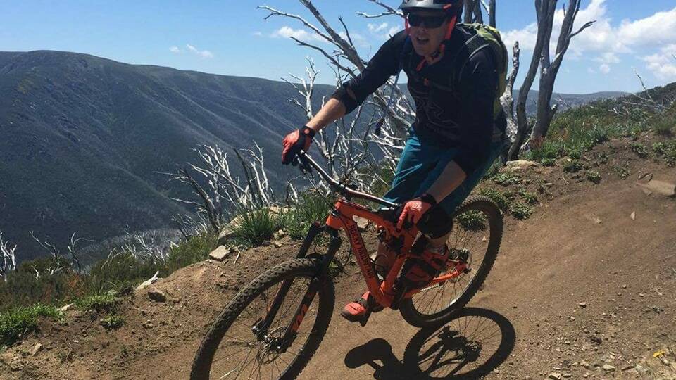 ADVENTURER: Dale Seabrook riding his mountain bike at Falls Creek. He and Kate loved outdoor activities and moved to Canada to ski and explore.