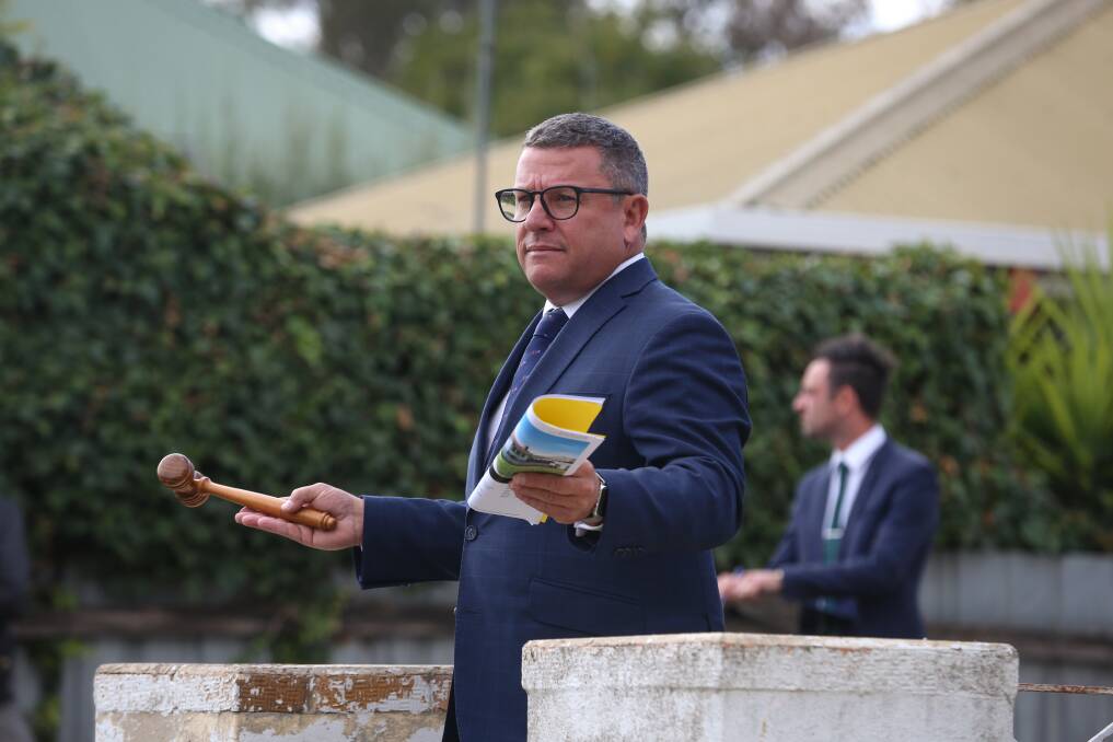 PROPERT BOOM: McGrath Auctioneer Phillip Bell during the sale of 280 Olive Street, South Albury. The aged home sold for $401,000, exceeding expectations. Picture: JAMES WILTSHIRE 