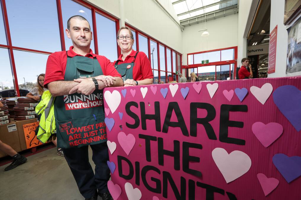 FOR HER: Steven Fitourakis and Katie Holden of Bunnings Albury are calling on residents to dig dig and help women in need. Picture: JAMES WILTSHIRE