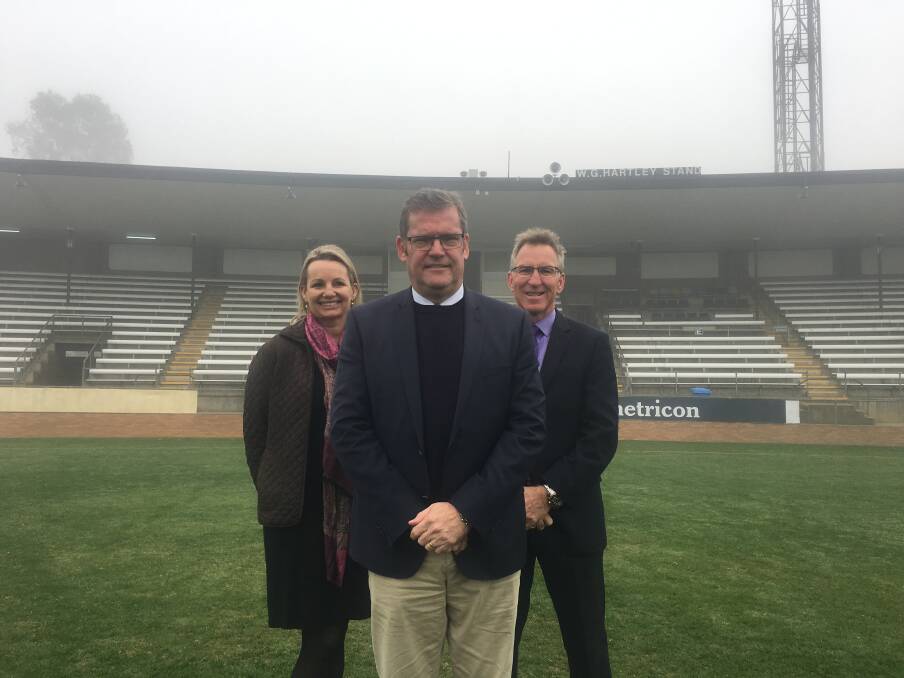 REVAMP: Member for Farrer Sussan Ley, Minister for Regional Development John McVeigh and Albury mayor Kevin Mack at the Lavington Sportsground which will be turned into a premier facility.