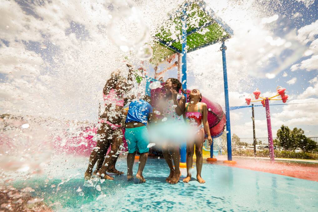 MAKING A SPLASH: Kimmie Agbazue, 5, Solomon Mbachilin, 8, Ryan Agbazue, 3, Avadoo Mbachilin, 6, and Ashley Anyanwu, 5 cooling of at Wodonga pool earlier this month. Picture: JAMES WILTSHIRE