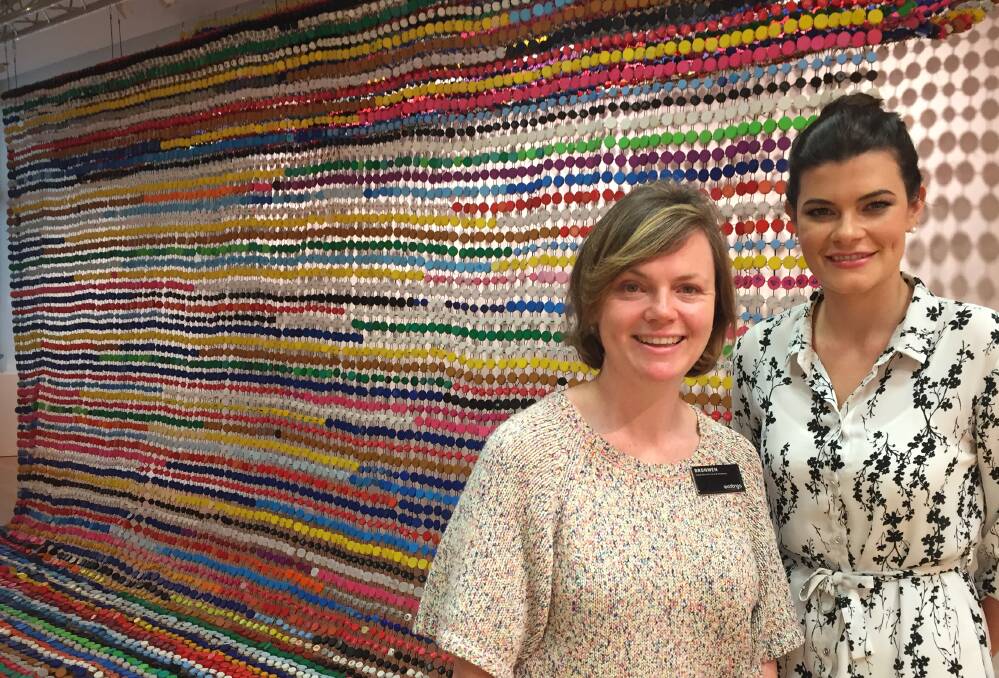 COLOUR: Curator Bronwen Garner and Wodonga councillor Kat Bennett with the Wanton, Wild and Unimagined exhibition at Wodonga Art Space.