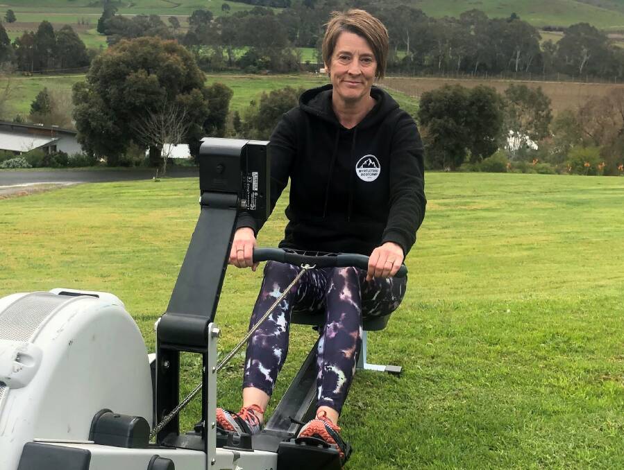 VIRTUAL CHALLENGE: Myrtleford Bootcamp participant Helen Howell, along with eight others, are rowing or running their way to the Albury-Wodonga Regional Cancer Centre during lockdown.